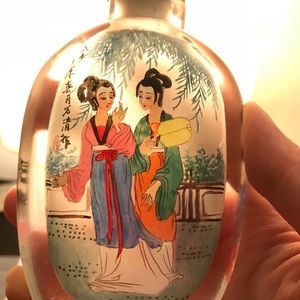 Antique bottle with pictures drawn from inside